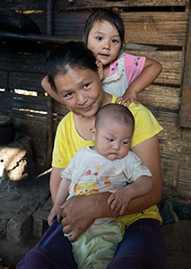 Woman in Myanmar with her children